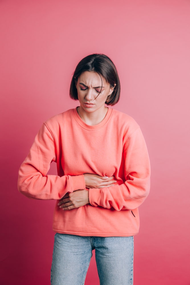 young female having symptoms of IBS